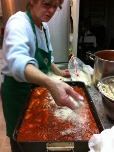 parmesan added to lasagna